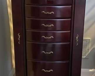 Lot 3212 $95.00  Jewelry Armoire Chest w/ 8 Drawers and Side Cabinets  18" W x 15" D x 40" H	Very attractive and functional to keep your jewelry.