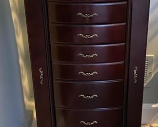 Lot 3212 $95.00  Jewelry Armoire Chest w/ 8 Drawers and Side Cabinets  18" W x 15" D x 40" H	Very attractive and functional to keep your jewelry.