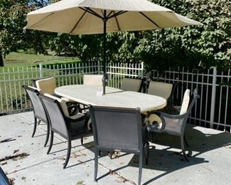 Lot 3150.  $1,200.00  Smith & Hawken Patio Set & 8 chairs, cream cushions, plus umbrella and stands. The tabletop has mosaic details.  Owner paid $4500 + Cushion Price. + $569 for Umbrella (Sunbrella Fabric), So you can get a screaming hot deal for this price and it looks exceptional!   