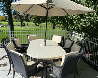 Lot 3150.  $1,200.00  Smith & Hawken Patio Set & 8 chairs, cream cushions, plus umbrella and stands. The tabletop has mosaic details.  Owner paid $4500 + Cushion Price. + $569 for Umbrella (Sunbrella Fabric), So you can get a screaming hot deal for this price and it looks exceptional!   