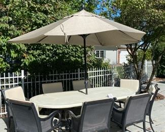 Lot 3150.  $1,200.00  Smith & Hawken Patio Set & 8 chairs, cream cushions, plus umbrella and stands. The tabletop has mosaic details.  The owner paid $4500 + Cushion Price. + $569 for Umbrella (Sunbrella Fabric) BTW the cushions were ALWAYS kept indoors when not in use.  They are pristine.  