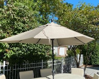 Lot 3150.  $1,200.00  Smith & Hawken Patio Set & 8 chairs, cream cushions, plus umbrella and stands. The tabletop has mosaic details.  The owner paid $4500 + Cushion Price. + $569 for Umbrella (Sunbrella Fabric) BTW the cushions were ALWAYS kept indoors when not in use.  They are pristine.  