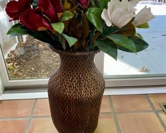 Lot 3165.  $35.00  Attractive wicker urn with florals.  The sides of this urn are slightly flattened so that it can be laid on its side for display as well.  25"H x 12"D	