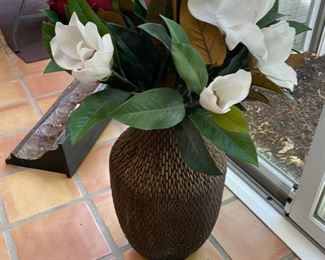 Lot 3165.  $35.00  Attractive wicker urn with florals.  The sides of this urn are slightly flattened so that it can be laid on its side for display as well.  25"H x 12"D	