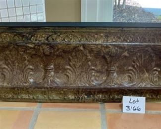 Lot 3166. $50.00  Distressed embossed tin-faced shelf.  Decor in relief on front of shelf.  Great accent piece.  49"w x 7.5"d x 13"t	
