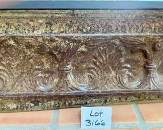 Lot 3166. $50.00  Distressed embossed tin-faced shelf.  Decor in relief on front of shelf.  Great accent piece.  49"w x 7.5"d x 13"t	