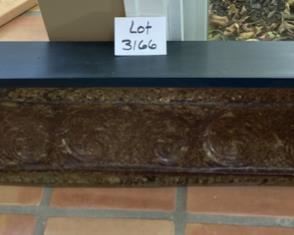 Lot 3166. $50.00  Distressed embossed tin-faced shelf.  Decor in relief on front of shelf.  Great accent piece.  49"w x 7.5"d x 13"t	