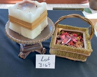 Lot 3169.  $28.00  Legacy candle plate with square 4-wick candle. Lot includes a cute, straw wrapped basket as well. 	
