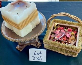 Lot 3169.  $28.00  Legacy candle plate with square 4-wick candle. Lot includes a cute, straw wrapped basket as well. 	