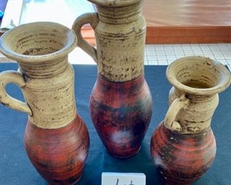 Lot 3170. $60.00/set  Artful trio of pottery pitcher/urns. Three different sizes make this display interesting, and we love the colors.   Made in Mexico in earth tones of red and cream.  