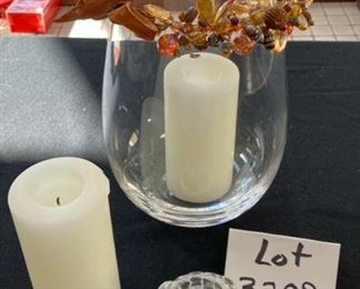Lot 3209.  $25.00 14" Tall glass hurricane with bead swag; cute Kosta Boda votive and 2 white pillar candles.