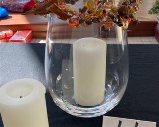 Lot 3209.  $25.00 14" Tall glass hurricane with bead swag; cute Kosta Boda votive and 2 white pillar candles.