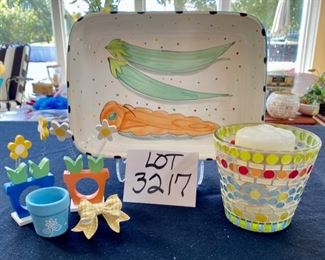 Lot 3217.  $20.00 Cute baking dish with veggie theme (11." x 8.5" x 2.5") 4 napkin rings and a mosaic candle holder.		