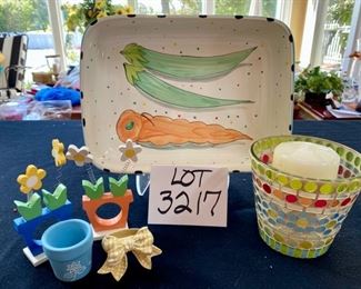 Lot 3217.  $20.00 Cute baking dish with veggie theme (11." x 8.5" x 2.5") 4 napkin rings and a mosaic candle holder.		