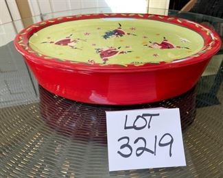 Lot 3219. $45.00 Counter Art Dancing Santas oval baker with lid that doubles as a tray/platter.  There is a liner inside the baker. 	