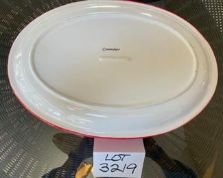 Lot 3219. $45.00 Counter Art Dancing Santas oval baker with lid that doubles as a tray/platter.  There is a liner inside the baker. 	