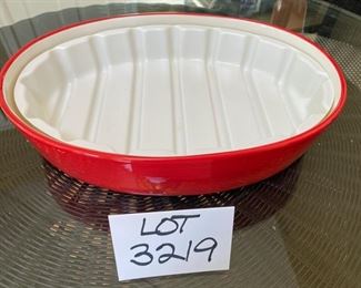 Lot 3219. $45.00 Counter Art Dancing Santas oval baker with lid that doubles as a tray/platter.  There is a liner inside the baker. 	