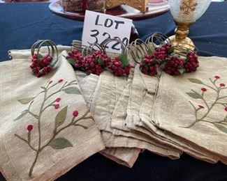 Lot 3220. $32.00  8 Crate and Barrel Gold napkins and 8 Crate and Barrel  holly napkin rings ; Melrose International Co. red pedestal plate (12.5" x 8' x 3.5" t); Gold star shaped box with potpourri and a Holiday star footed hurricane.		