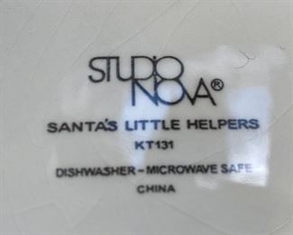 Lot 3223.  $32.00 Cute holiday party serveware.  Studio Nova 'Santa's Little Helper' 12" cake plate, divided relish tray and 4 section serve dish. (19.5" long