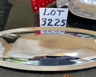 Lot 3225. $50.00.  A lovely assortment of mixed metal and glass holiday serving pieces, and very festive at that!  An 8" x 8" star dish by ARTHUR COURT; Lori Sievert for Silvestri hand blown rectangular Christmas plate (15" x 8.5"); so mod 17" x 7" Kromex silver tray and a cute 15" x 5.5" candy dish shaped like wrapped hard candy.  		