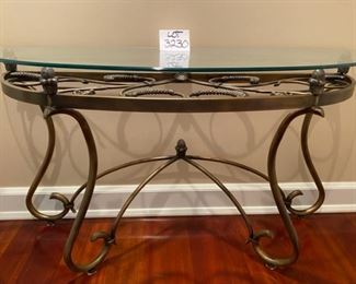 Lot 3230.  $295.00   Fabulous glass half-moon, or "Demi Lune" table with wrought iron artfully swirled on the base and under the glass top.  This is a substantial table, 52"W x 18"D x 29" H.   Perfect for a foyer, or behind a sofa, or holding a lamp.  