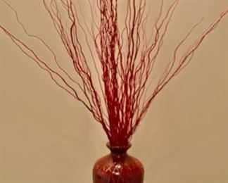 Lot 3231. $38.00  Ceramic vase with reddish glaze and burnt red twigs, triangle design in relief.  Very striking.  I love this piece, how dramatic it looks under that spotlight!  
