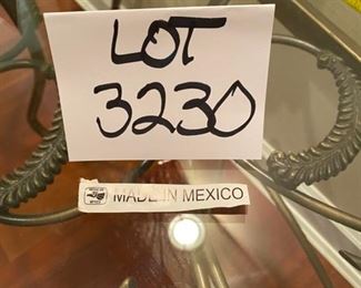 Lot 3230.  $295.00   Fabulous glass half-moon, or "Demi Lune" table with wrought iron artfully swirled on the base under the glass top.  This is a substantial table, 52"W x 18"D x 29" H.   Perfect for a foyer, or behind a sofa, or holding a lamp.  