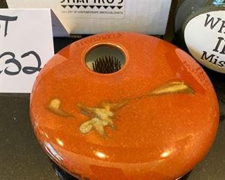 Lot 3232.  $24.00 Two cute pieces make up this lot. 1)Georgetown Pottery vase Ikebana-style, with a nifty flower frog.  (love the color for Fall!) and a sweet figurine holding out his pocket "What the IRS missed",  a cork-topped money jar.  