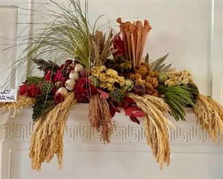 Lot 3242. $150.00  Stunning botanical table or shelf arrangement.  This beautiful piece is an artfully arranged grouping of dried flowers, grasses, pods and a few silk flowers.  It is substantial in size (48"w x 34"t) certainly would be a focal point for any room it is placed in.		