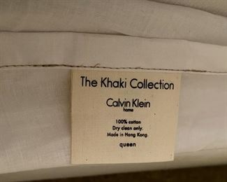 Lot 3243. $125.00  Nice Full/Queen bed linen set, Queen Duvet cover and inner duvet quilt, matching bed skirt,  5 decorative pillows.  All from the 'Khaki Collection by Calvin Klein. Great deal for this set. 