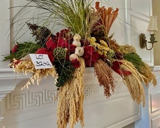 Lot 3242. $150.00  Stunning botanical table or shelf arrangement.  This beautiful piece is an artfully arranged grouping of dried flowers, grasses, pods and a few silk flowers.  It is substantial in size (48"w x 34"t) certainly would be a focal point for any room it is placed in.		