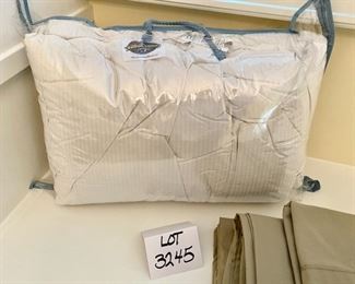 Lot 3245.  $65.00 Pacific Coast Queen Quilt and a set of Westpoint Stevens full sheets (includes 1 ea flat and fitted sheet and pillow case).