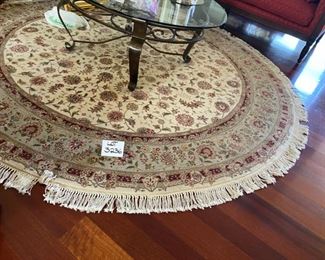 Lot 3236.  $995.00  Tom's Price 8' round rug. genuine hand knotted 100% wool pile.  colors : red, green, cream and taupe.  Perfect condition. Pd $2200		