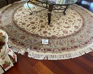 Lot 3236.  $995.00  Tom's Price 8' round rug. genuine hand knotted 100% wool pile.  colors : red, green, cream and taupe.  Perfect condition. Pd $2200	