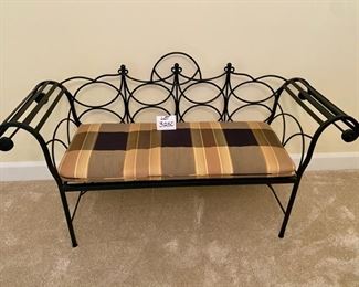Lot 3250. $250.00  Black wrought Iron bench with rolled arms and plaid cushion.This bench is nice sized, 60"W x 19"D x 17"H	Bench Fabric matches Kitchen Chairs in Lot 3173	