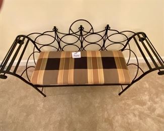 Lot 3250. $250.00  Black wrought Iron bench with rolled arms and plaid cushion.This bench is nice sized, 60"W x 19"D x 17"H	Bench Fabric matches Kitchen Chairs in Lot 3173	