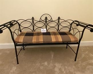 Lot 3250. $250.00  Black wrought Iron bench with rolled arms and plaid cushion.This bench is nice sized, 60"W x 19"D x 17"H	Bench Fabric matches Kitchen Chairs in Lot 3173	