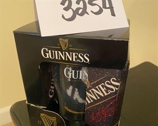 Lot 3254.  $15.00 Guiness Mini-bar pack  includes 1 pint glass, 1 bar towel and 10 coasters.		 