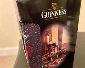 Lot 3254.  $15.00 Guiness Mini-bar pack  includes 1 pint glass, 1 bar towel and 10 coasters.		 