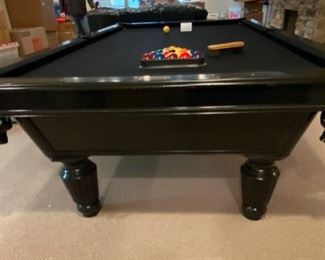 Lot 3271A. $975.00  AMF Play Master 8' regulation, slate top pool table.  This is a sleek black wood frame table with leather pockets and dramatic black felt top.  This lot includes 6 cues, 1 bridge, 1 set of billiard balls and table accessories. In great condition.  Ask us about the Pool Table Service, we use to deliver and assemble this pool table. This item will need to be professionally moved! 