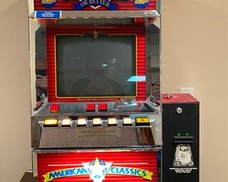 Lot 3273. 	$250.00  American Classics Draw Poker Slot Machine by SMK Corp 1991 that is Casino quality.   This slot machine comes with keys and a dollar bill changer.  The machine does turn on, lights up and appears to operate but the CRT Screen does not work and repairable.