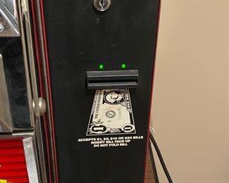 Lot 3273. 	$250.00  American Classics Draw Poker Slot Machine by SMK Corp 1991 that is Casino quality.   This slot machine comes with keys and a dollar bill changer.  The machine does turn on, lights up and appears to operate but the CRT Screen does not work and repairable.