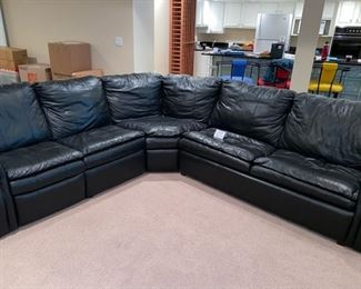 Lot 3274. $895.00 Super Sagles, Inc. 3 pc Leather sectional with Queen sleeper and wall saver recliner. Approximately 8' x 8.5' sides and 13'2" diagonal, height 32".