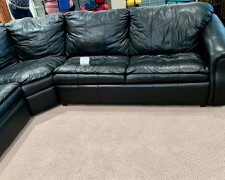Lot 3274. $895.00 Super Sagles, Inc. 3 pc Leather sectional with Queen sleeper and wall saver recliner. Approximately 8' x 8.5' sides and 13'2" diagonal, height 32".