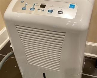 Lot 3277A. 1 of 2 $160.00 GE dehumidifier model ADEL70LRL2, 70pt capacity.  This dehumidfier comes with a 25' hose. Retails over $299.00 + $20.00 Hose  