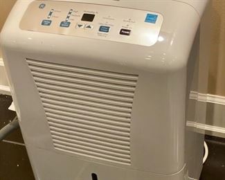 Lot 3277A. 1 of 2 $160.00 GE dehumidifier model ADEL70LRL2, 70pt capacity.  This dehumidfier comes with a 25' hose. Retails over $299.00 + $20.00 Hose  