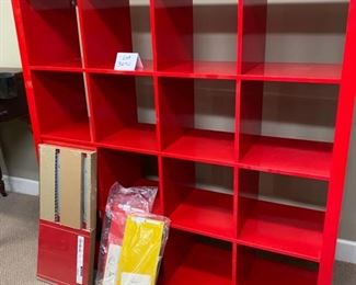 Lot 3290. $80.00 Red Ikea Expedit or Kallax #14729, 16 cube storage unit with double drawer insert. 59"w x 15.5"d x 59"t	 Will need to be disassembled to be removed by the purchaser. 