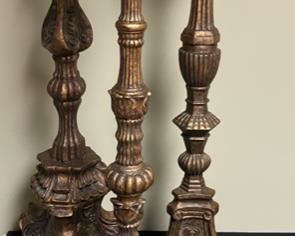 Lot 3293.  $65.00  3 tall, decorative candlesticks with pillar candles. These are very heavy pieces and appear to be pottery.  The sizes are: 28" x9", 26" x 8", 24" x 7".  Super nice.	