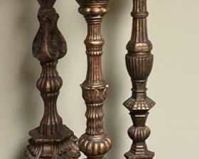 Lot 3293.  $65.00  3 tall, decorative candlesticks with pillar candles. These are very heavy pieces and appear to be pottery.  The sizes are: 28" x9", 26" x 8", 24" x 7".  Super nice.	