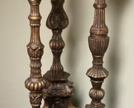 Lot 3293.  $65.00  3 tall, decorative candlesticks with pillar candles. These are very heavy pieces and appear to be pottery.  The sizes are: 28" x9", 26" x 8", 24" x 7".  Super nice.	